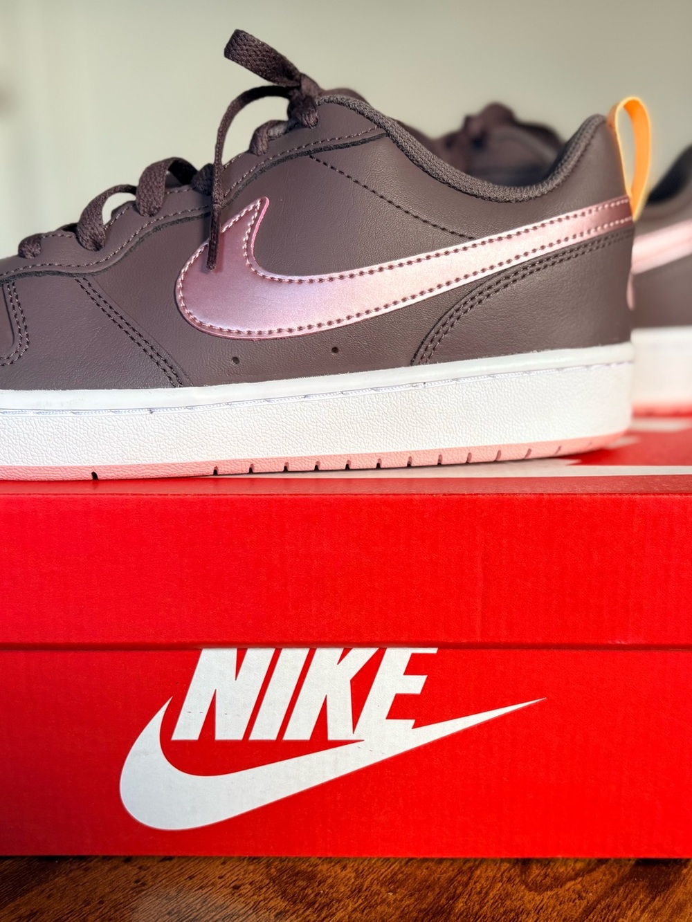 Nike sneakers with Pink Swoosh